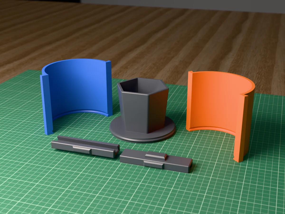 3D render of the hexagon planter master fused on its printed charcoal base, between the orange and blue round walls, with the charcoal clamps behind