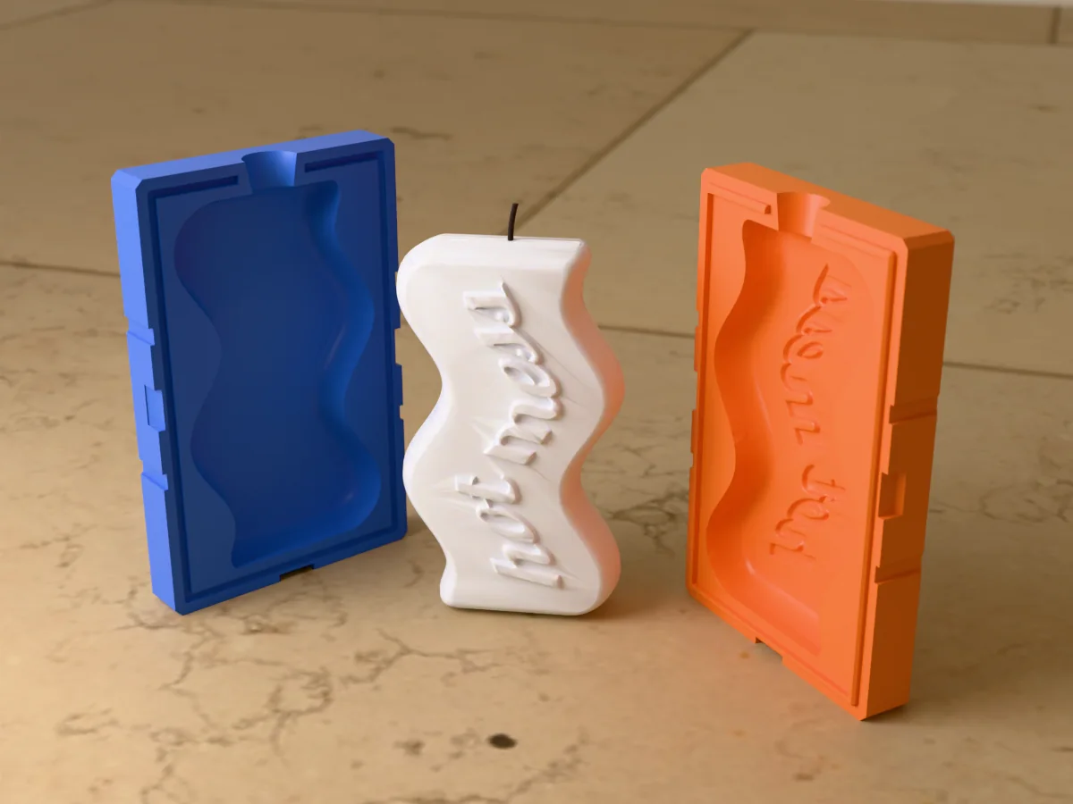 3D render of a wavy slab candle with "hot mess" in raised script between the two printed halves of its rigid orange and blue mold
