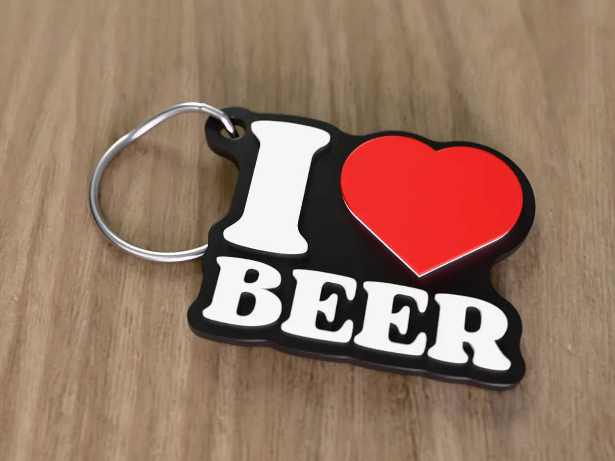 3D render of a black, white and red 3D-printed I love beer keychain with a steel split ring through its hole