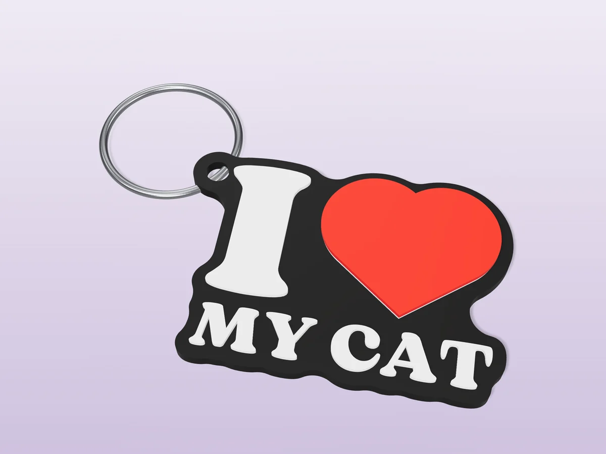 3D render of a black, white and red 3D-printed I love my cat keychain with a steel split ring through its hole