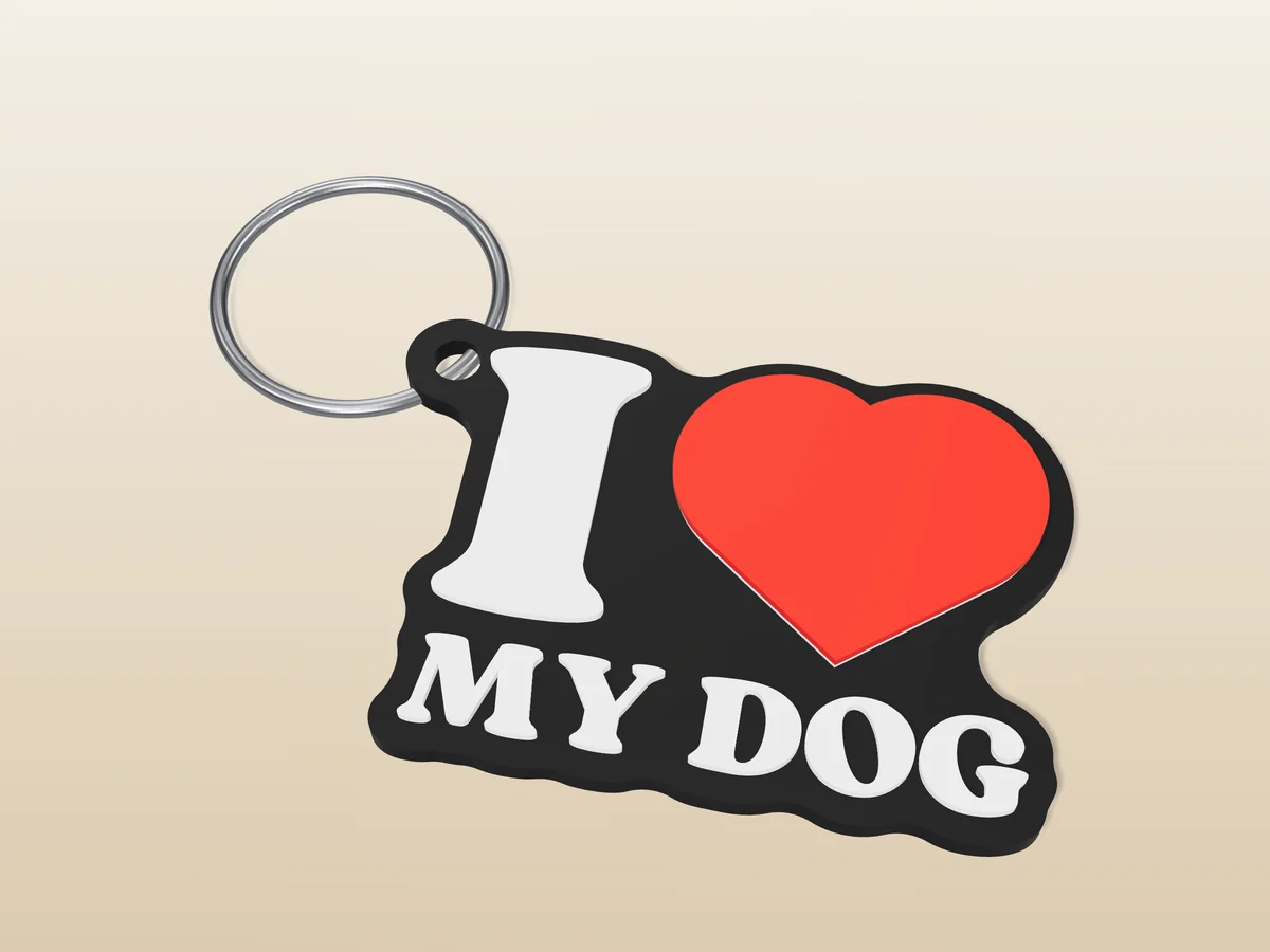 3D render of a black, white and red 3D-printed I love my dog keychain with a steel split ring through its hole
