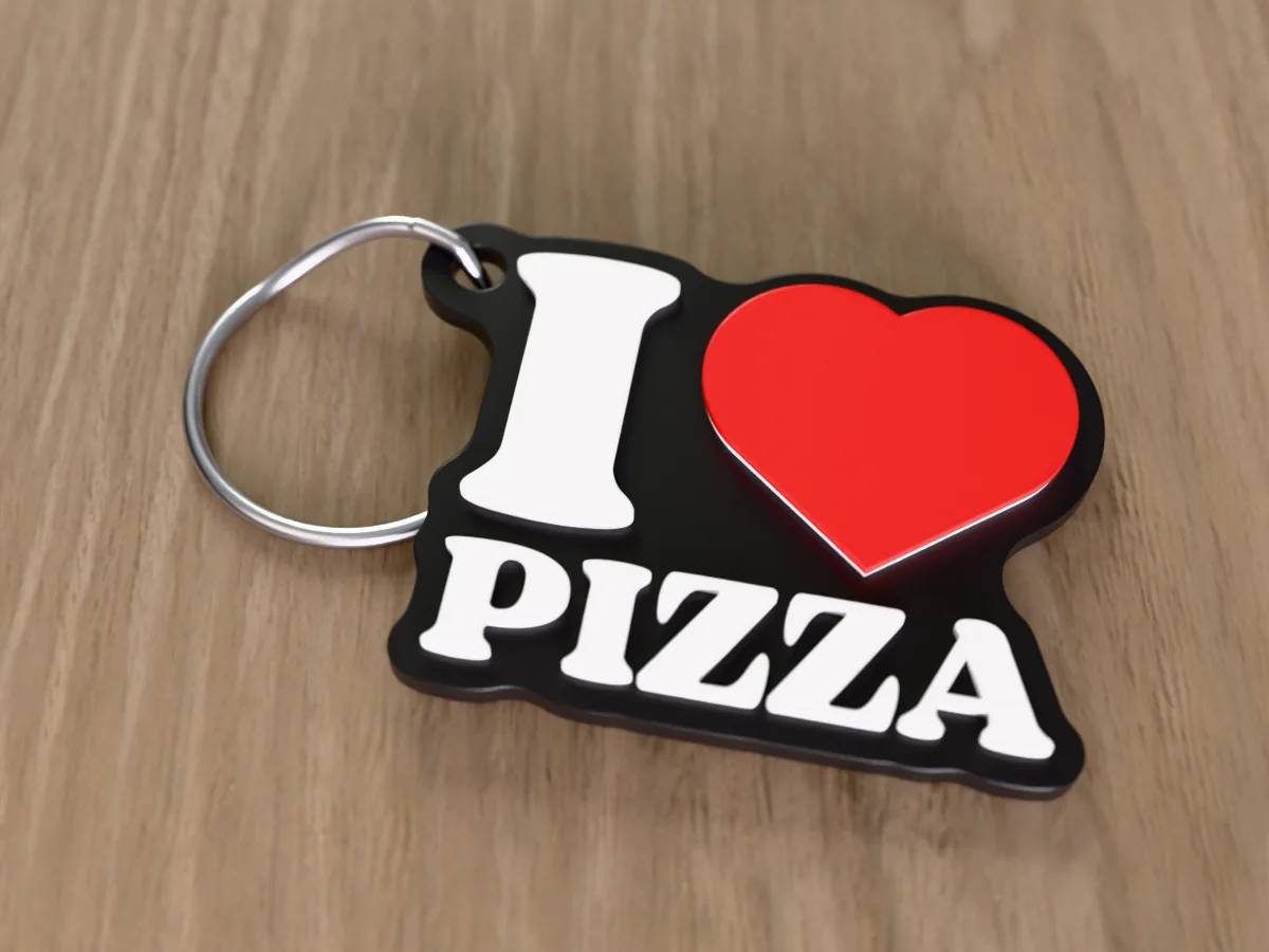 3D render of a black, white and red 3D-printed I love pizza keychain with a steel split ring through its hole