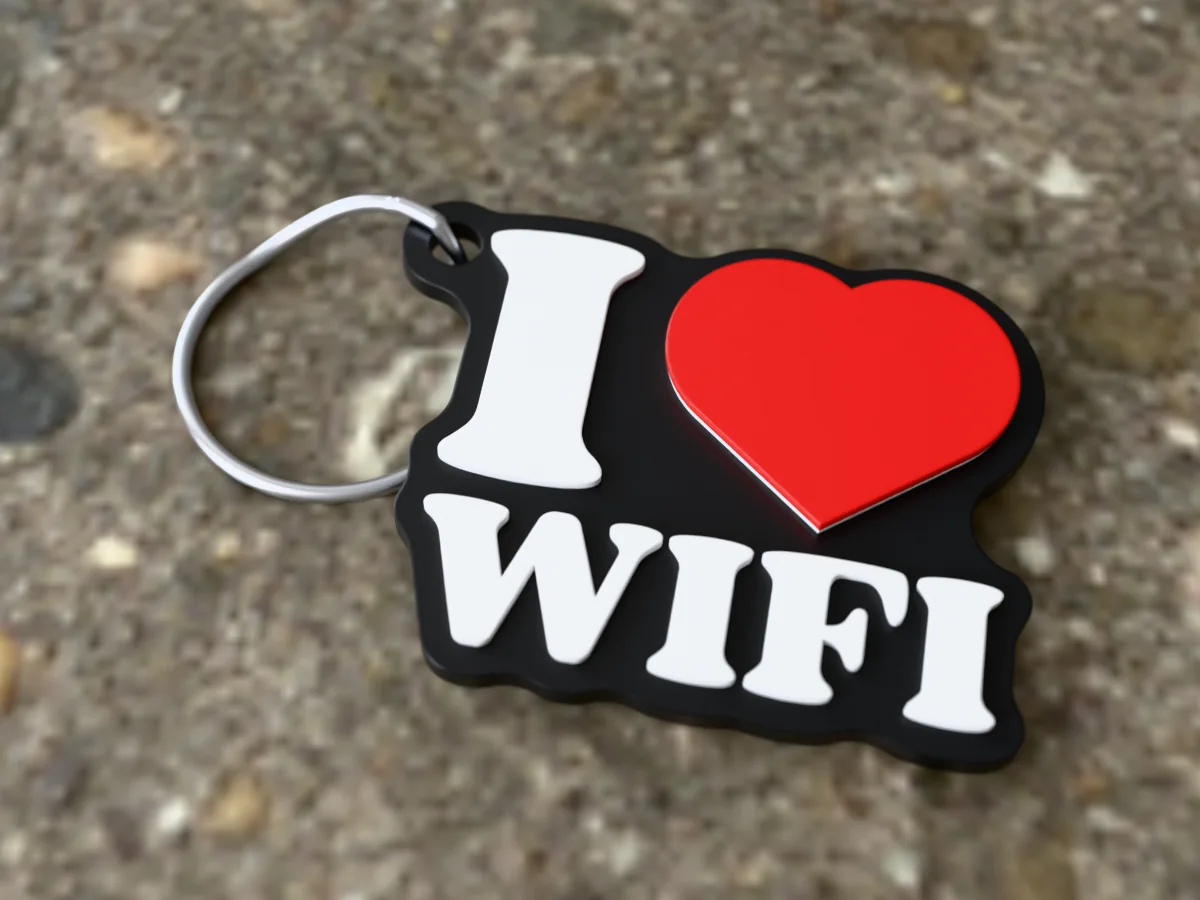 3D render of a black, white and red 3D-printed I love WiFi keychain with a steel split ring through its hole
