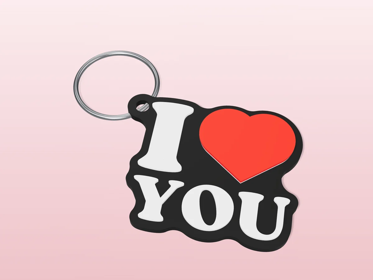3D render of a black, white and red 3D-printed I love you keychain with a steel split ring through its hole