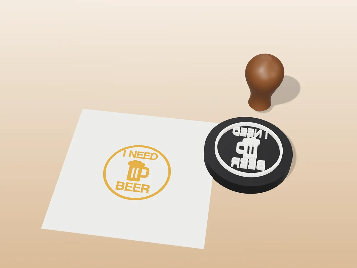 3D render of the printed i need beer stamp, face up next to its brown handle, and its amber ink print on a sheet of paper