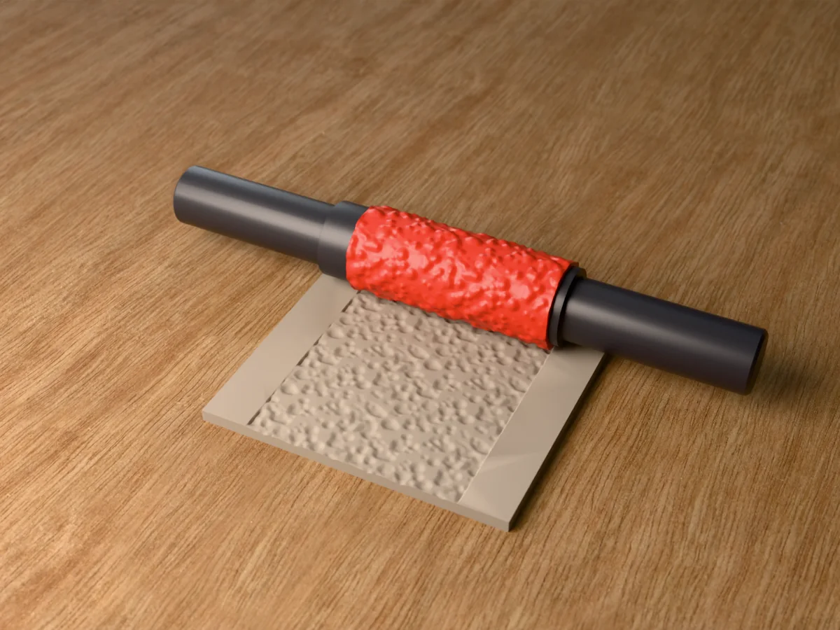 3D render of the printed lava rock textured rolling pin, its patterned sleeve between two dark handles, resting on a slab of clay it has pressed with pitted lava rock