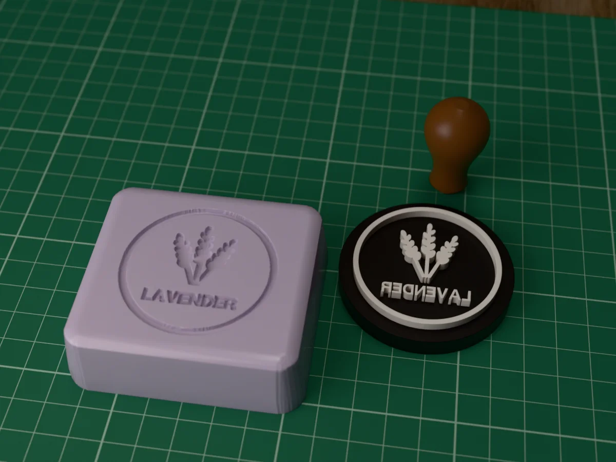 3D render of the printed lavender soap stamp, face up next to its brown handle, and a bar of soap with the stamp pressed into it