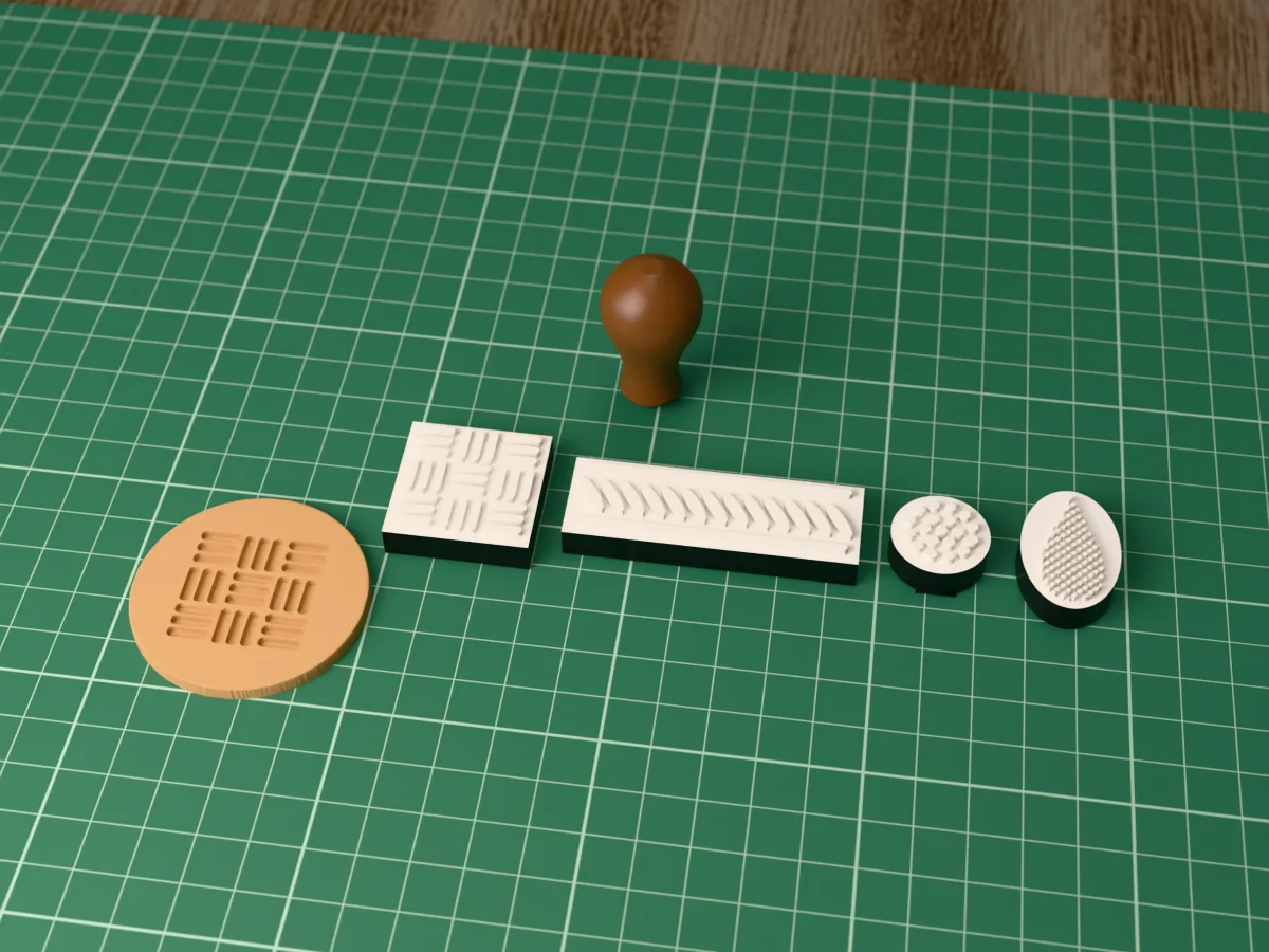 3D render of four printed leather tooling stamp plates, basket weave, rope border, seeder and pear shader, face up beside their brown handle, and a round leather blank pressed with the basket weave