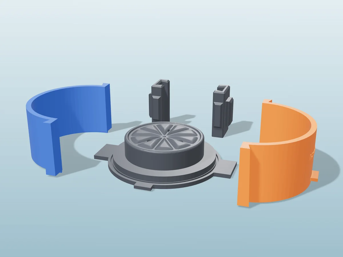 3D render of the lemon slice soap master fused on its printed charcoal base, between the orange and blue round walls, with the charcoal clamps behind
