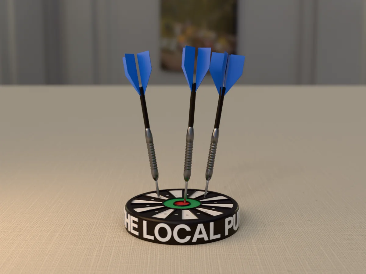 3D render, low view of the printed THE LOCAL PUB dart holder on a table, the name raised in white round the black case and three darts with blue flights standing in it