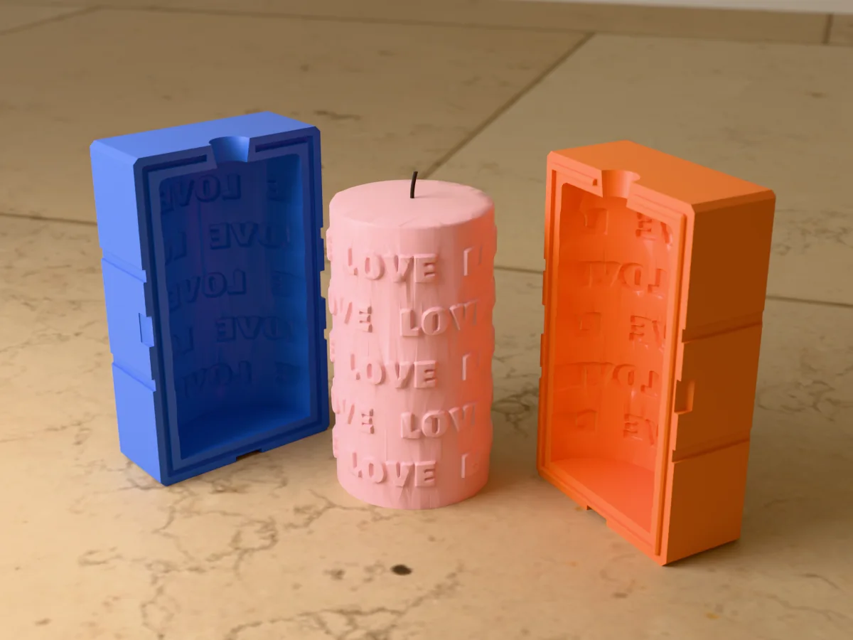 3D render of a blush pink pillar candle covered in raised LOVE lettering between the two printed halves of its rigid orange and blue mold