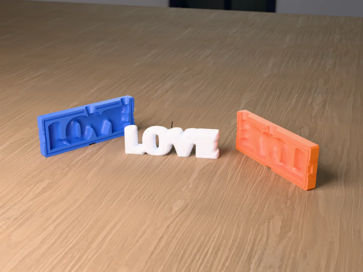 3D render of a LOVE bubble letter candle between the two printed halves of its rigid orange and blue mold