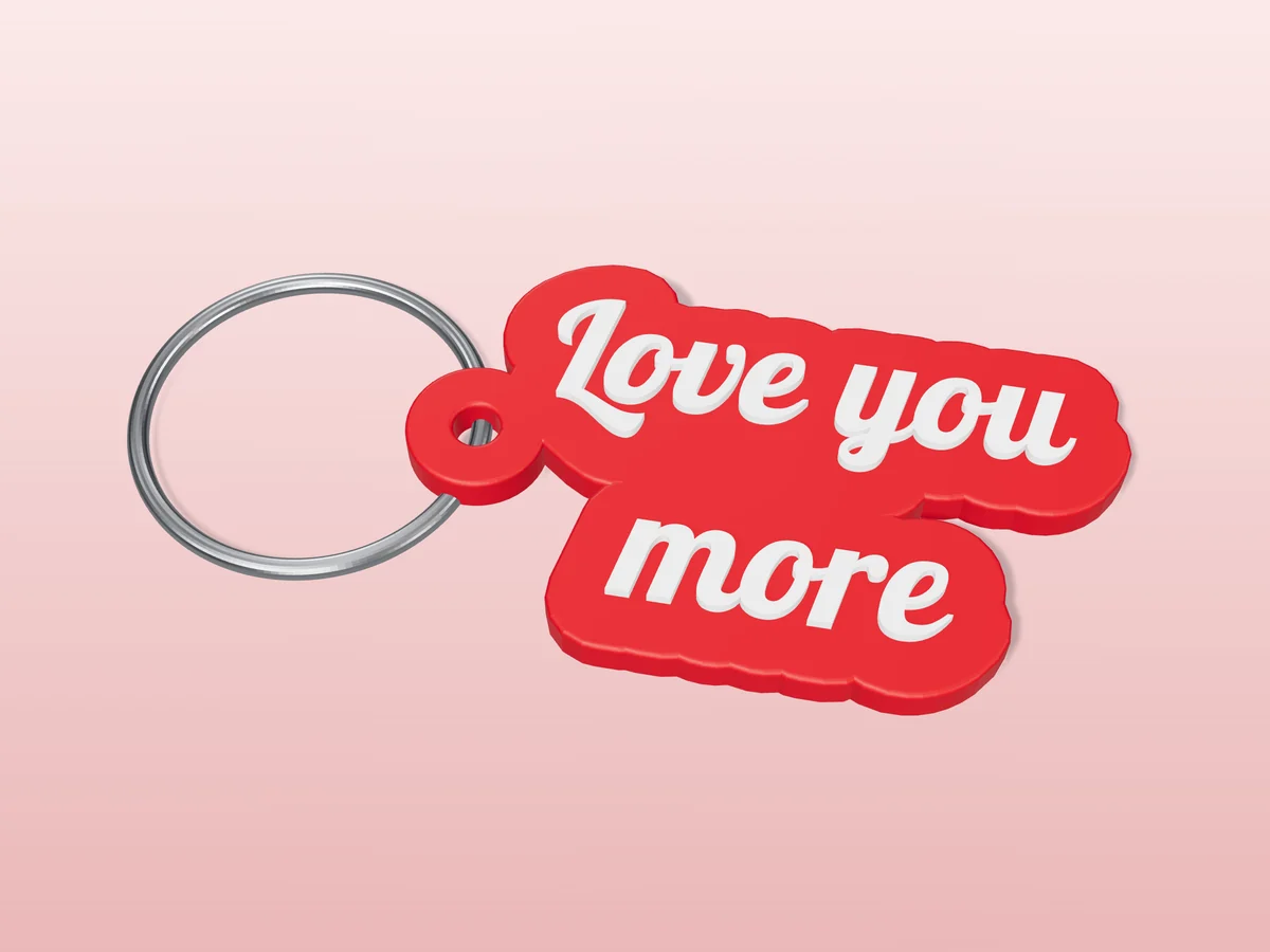 3D render of a red and white 3D-printed Love you more keychain with a steel split ring through its hole