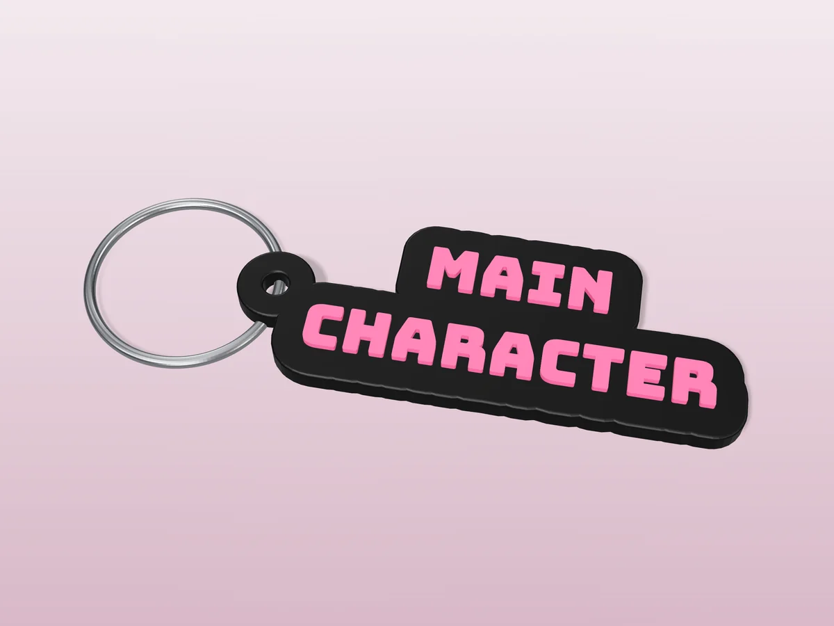 3D render of a black and hot pink 3D-printed Main character keychain with a steel split ring through its hole