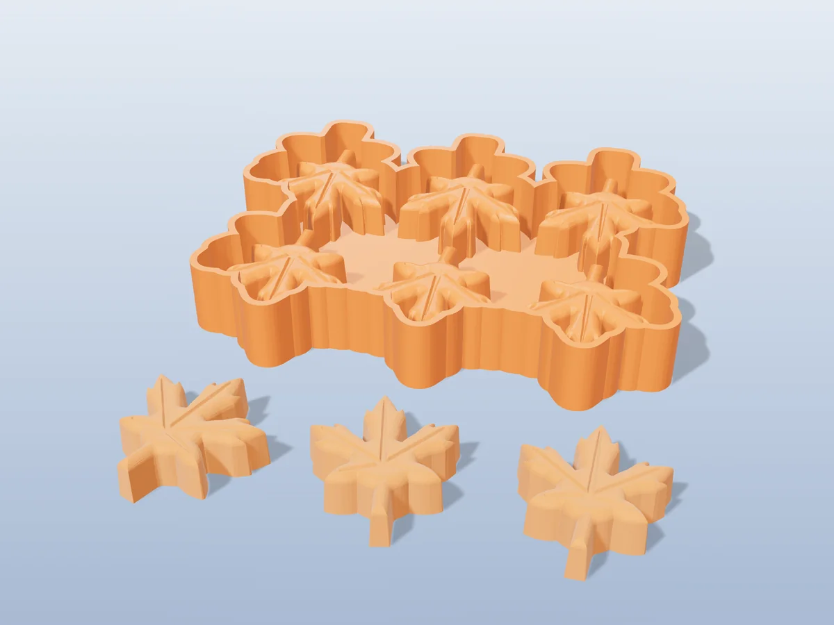 3D render of the printed caster for a six-leaf silicone wax melt tray, with three orange maple leaf wax melts in front