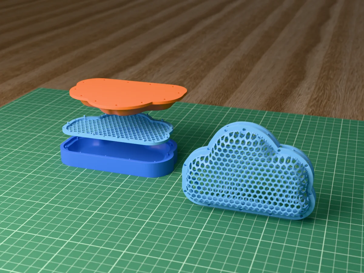 3D render of a light blue honeycomb-mesh cloud with a hanging hole on top, beside the blue cavity, the flat net and the orange plug of the press that forms it