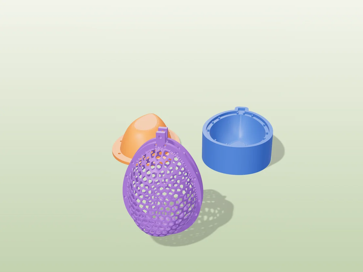 3D render of a purple honeycomb mesh Easter egg with a hanging tab, in front of the orange and blue press halves that form it