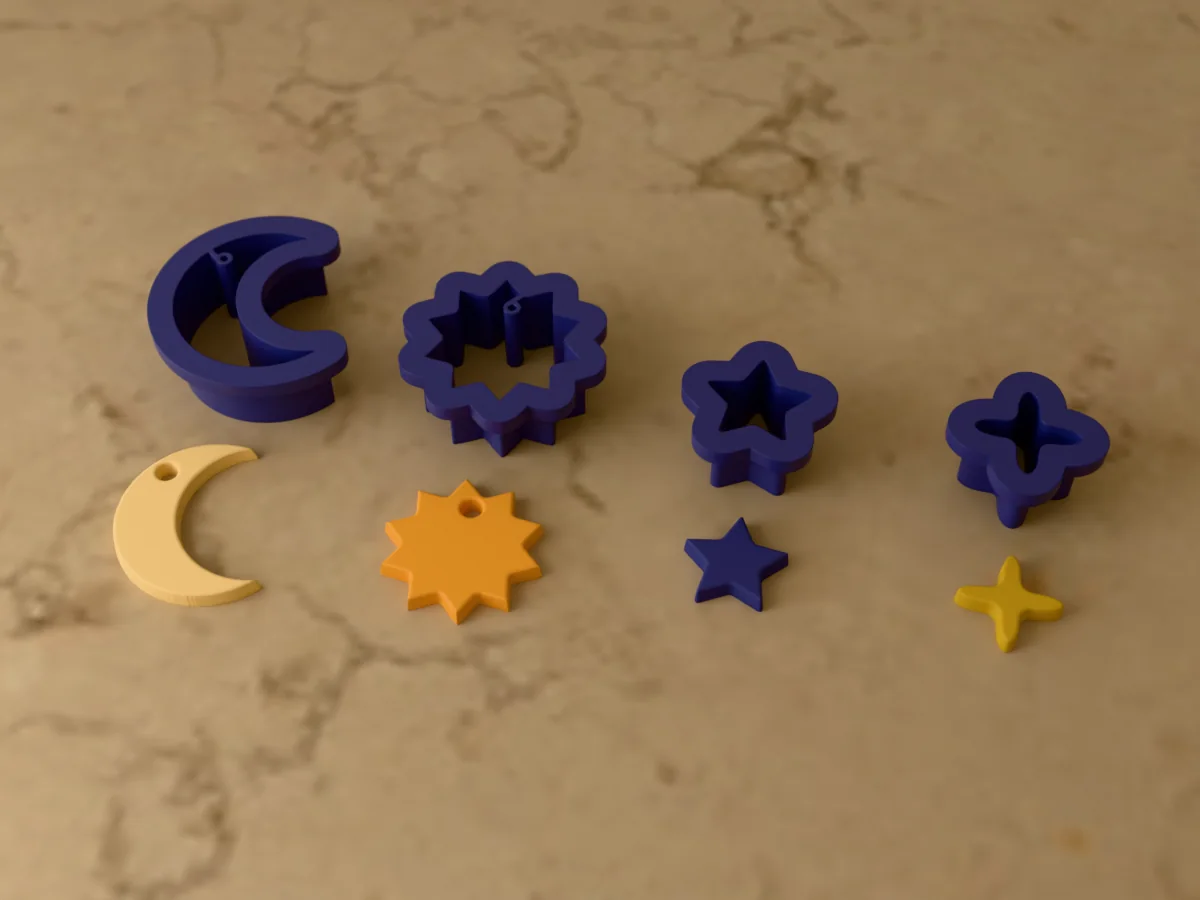 3D render of four 3D-printed navy blue polymer clay earring cutters (crescent moon 32 mm, sun 28 mm, star 18 mm and sparkle 18 mm) with the clay earring pieces they cut in front