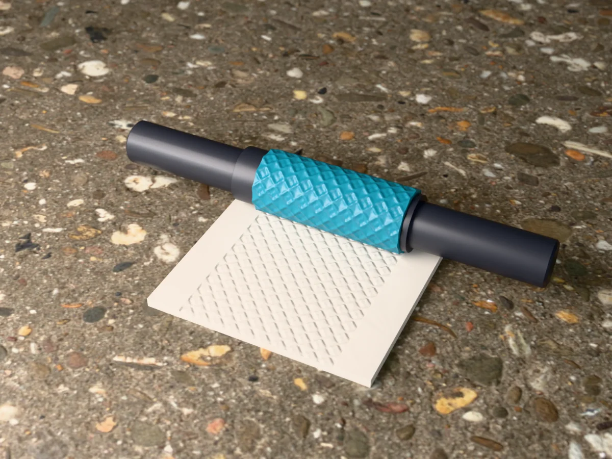 3D render of the printed moroccan quatrefoil textured rolling pin, its patterned sleeve between two dark handles, resting on a slab of clay it has pressed with Moroccan quatrefoils