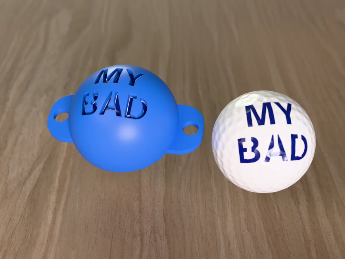 3D render of a blue 3D-printed golf ball stencil with MY BAD cut through it, sitting on a golf ball, next to a ball marked with MY BAD in blue