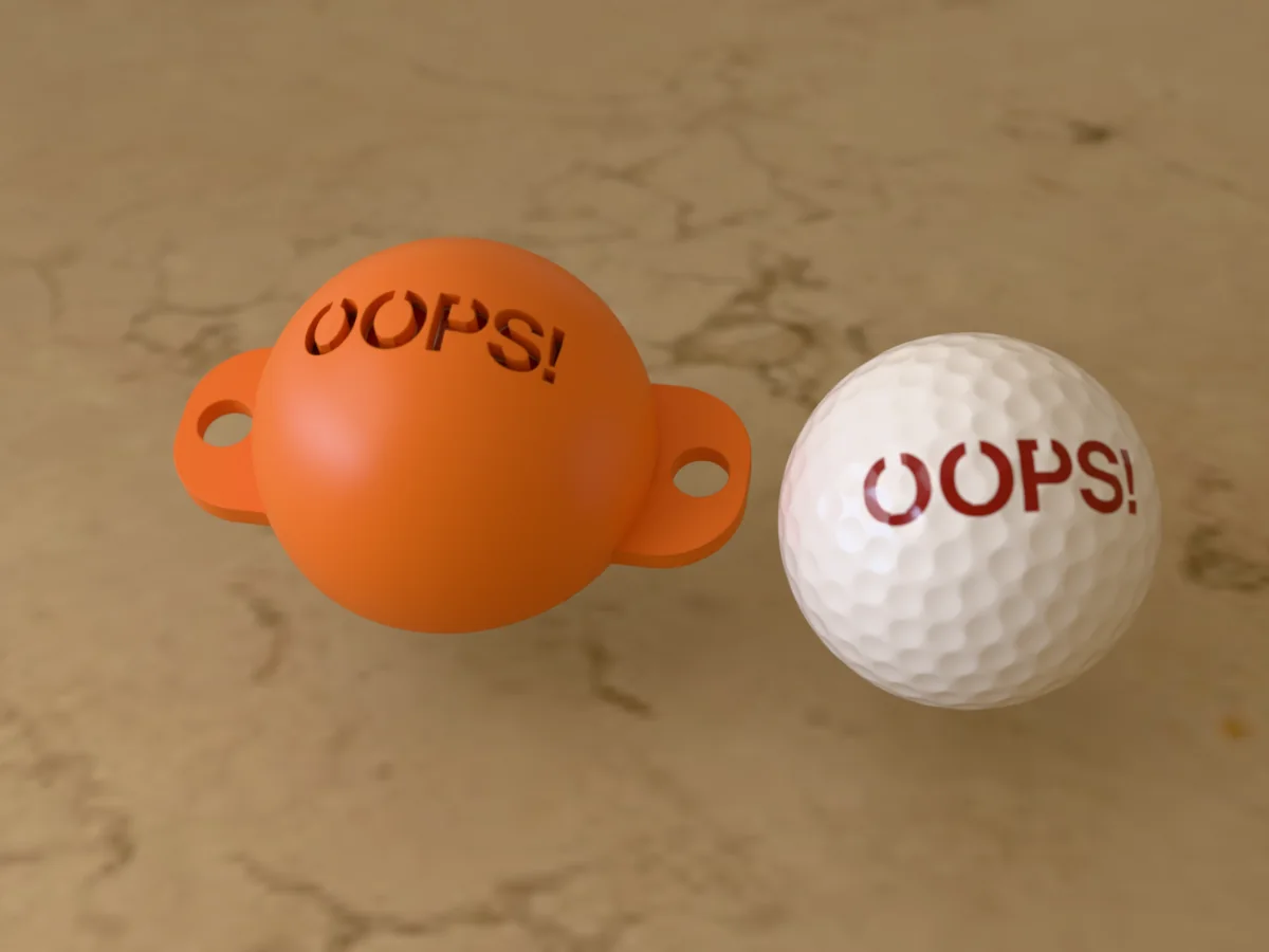3D render of an orange 3D-printed golf ball stencil with OOPS! cut through it, sitting on a golf ball, next to a ball marked with OOPS! in red