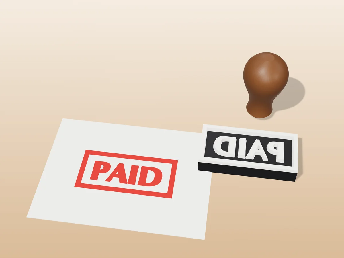 3D render of the printed paid stamp, face up next to its brown handle, and its red ink print on a sheet of paper
