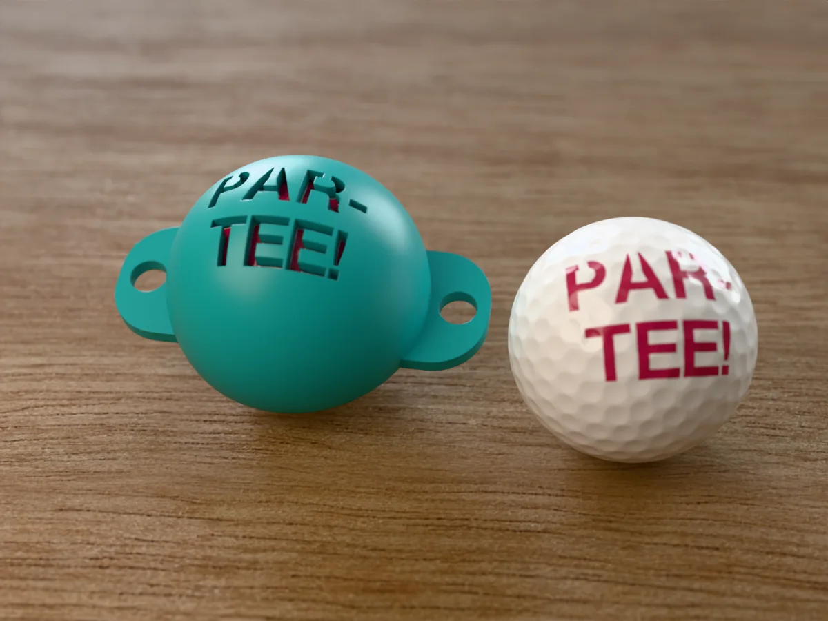 3D render of a teal 3D-printed golf ball stencil with PAR-TEE! cut through it, sitting on a golf ball, next to a ball marked with PAR-TEE! in pink