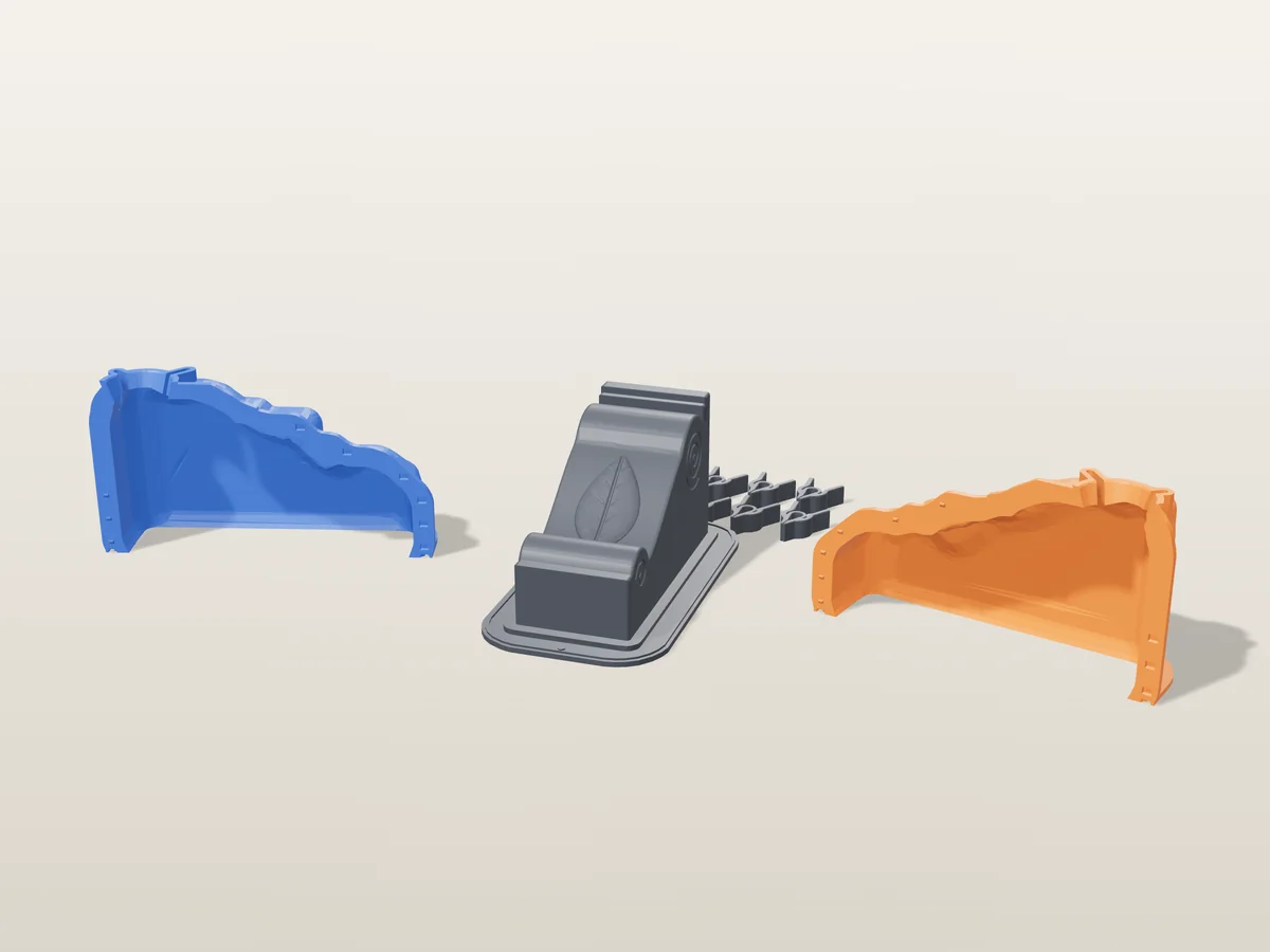 3D render of the scroll corbel master with its volutes and front leaf fused on its printed charcoal base, between the orange and blue shell halves, with the charcoal clamps behind