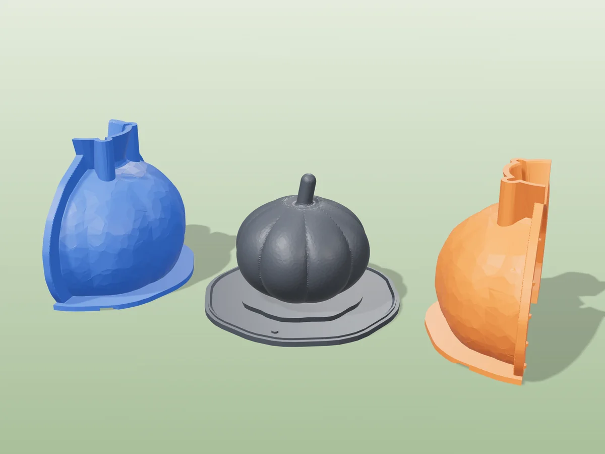 3D render of the eight-lobed pumpkin master with its curved stem fused on its printed charcoal base, between the orange and blue hugging shell halves