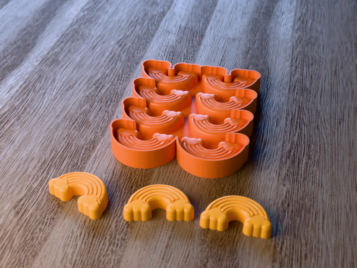 3D render of the printed caster for an eight-cavity rainbow crayon mold, with three yellow rainbow crayons with five bands on two clouds in front