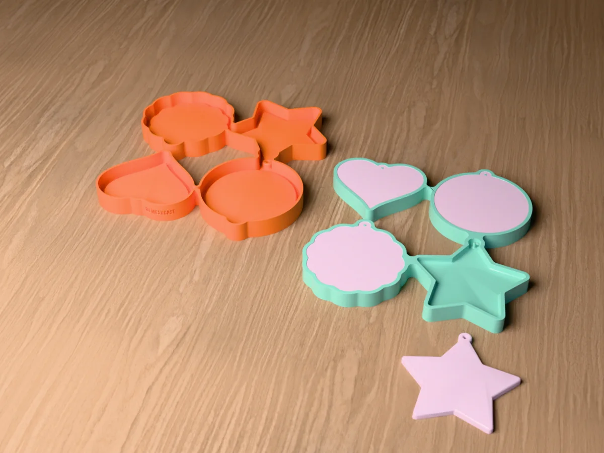 3D render of the printed caster for a resin ornament blank mold beside its silicone mold, with pale lilac resin circle, heart, star and scalloped blanks