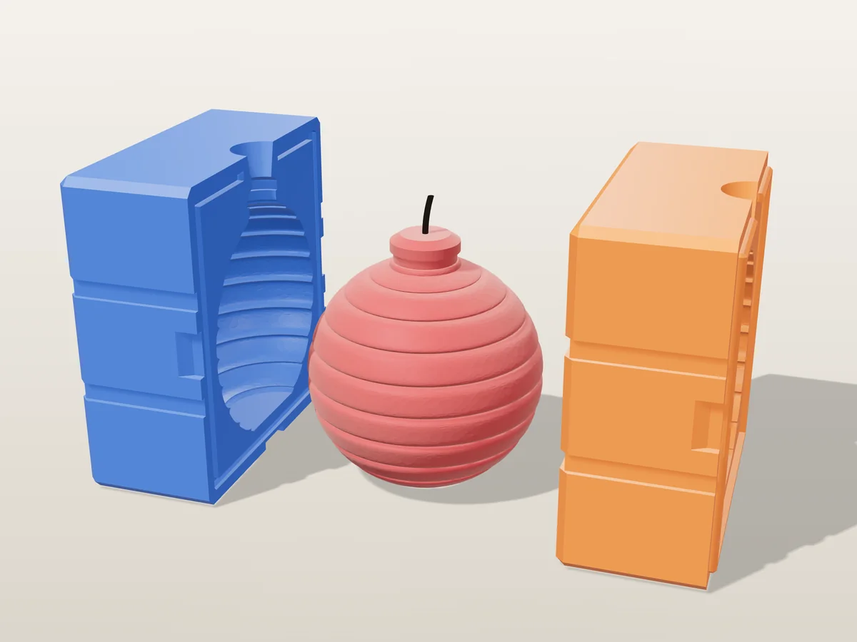 3D render of a deep red ribbed Christmas bauble candle with its ornament cap between the two printed halves of its rigid orange and blue mold