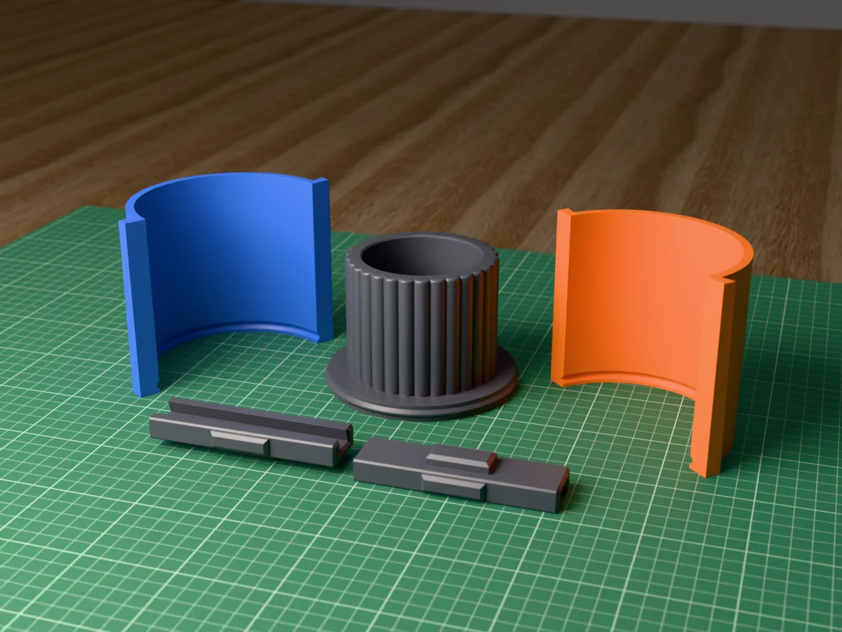3D render of the ribbed candle vessel master fused on its printed charcoal base, between the orange and blue round walls, with the charcoal clamps behind