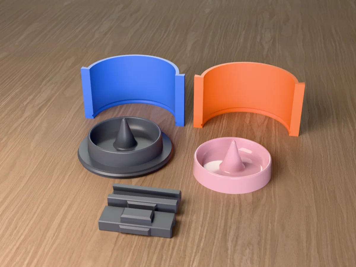 3D render of the ring cone dish master on its printed base between the orange and blue walls, with a pink resin ring dish in front
