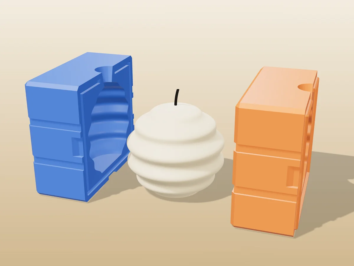3D render of a honey-coloured ringed orb candle between the two printed halves of its rigid blue and orange mold