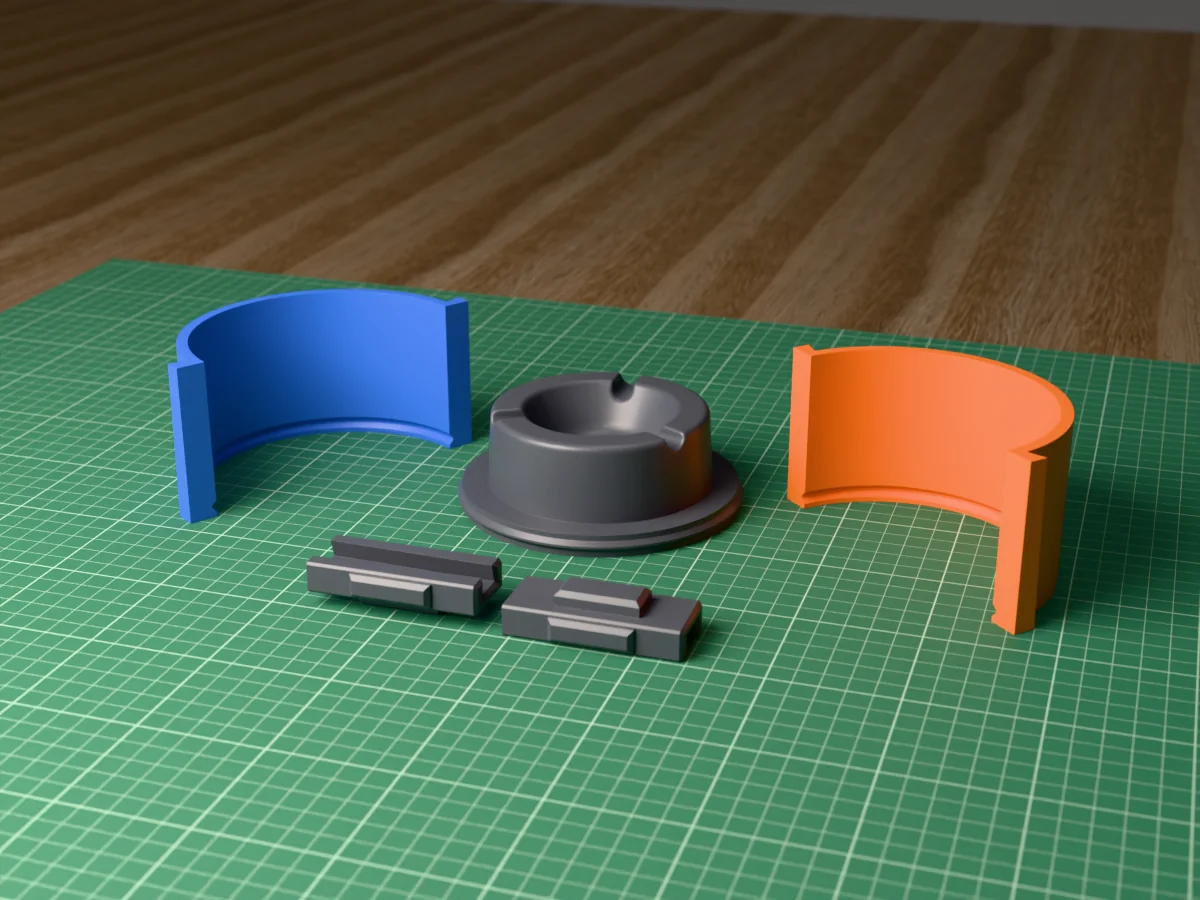 3D render of the round concrete ashtray master with three cigarette rests, fused on its printed charcoal base between the orange and blue round walls, with the charcoal clamps behind