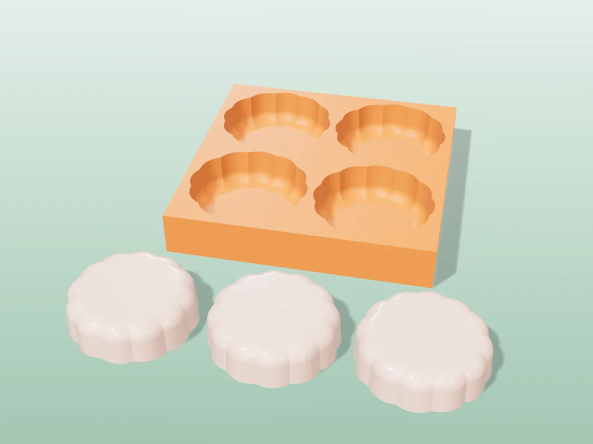 3D render of a printed orange tray with four scalloped round soap cavities, and three pink scalloped soaps in front