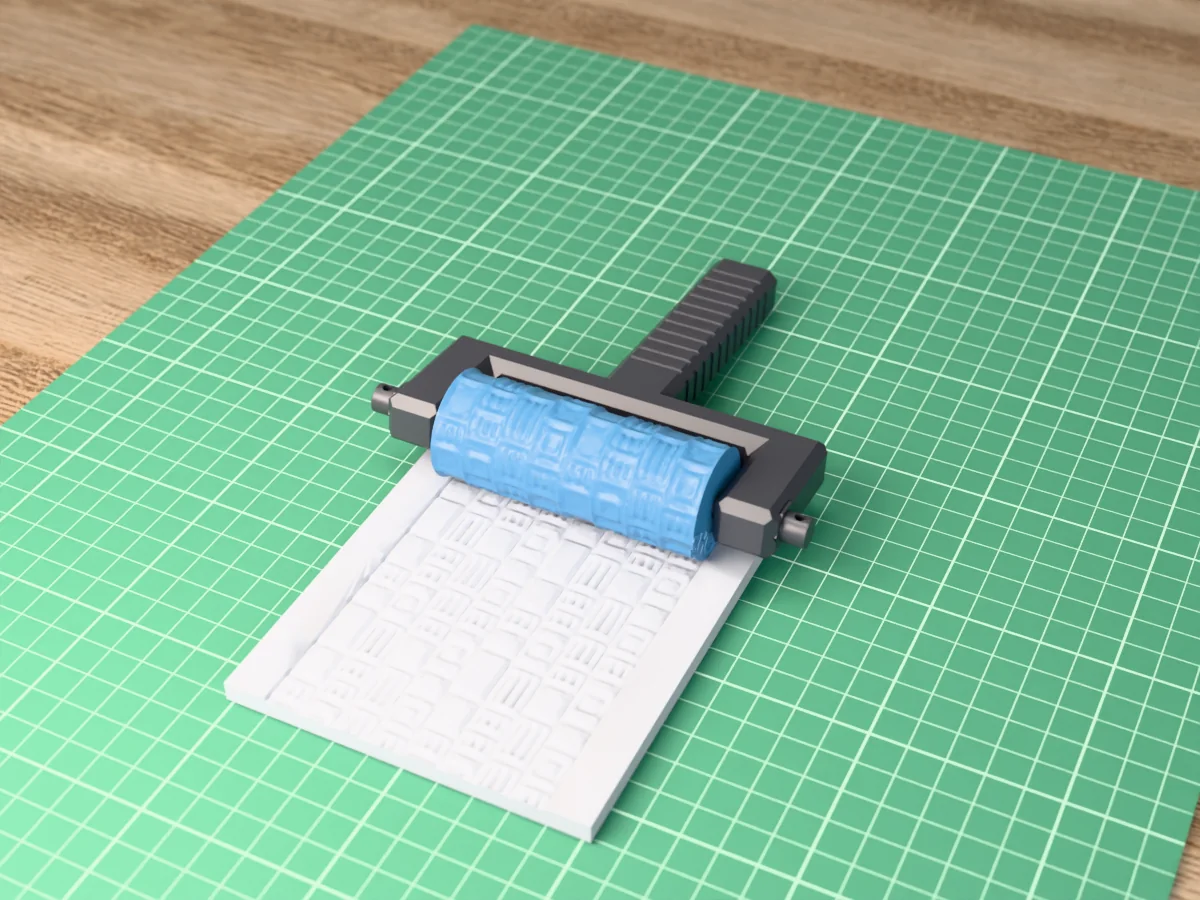 3D render of the printed sci-fi panel texture roller in its dark fork handle, resting on a slab of clay it has pressed with sci-fi deck plating