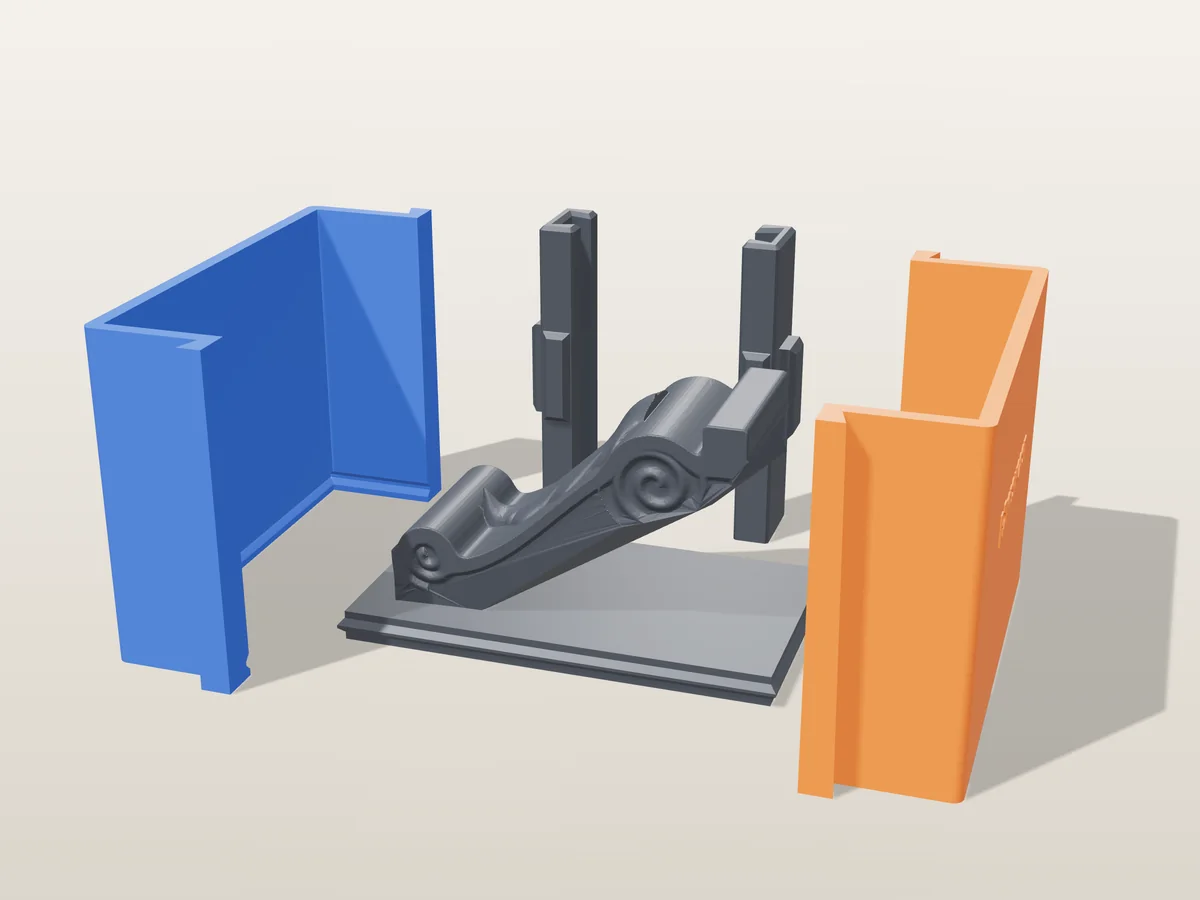 3D render of the scroll corbel master with its acanthus leaf and side spirals, lying on its back on the printed charcoal base, between the orange and blue walls