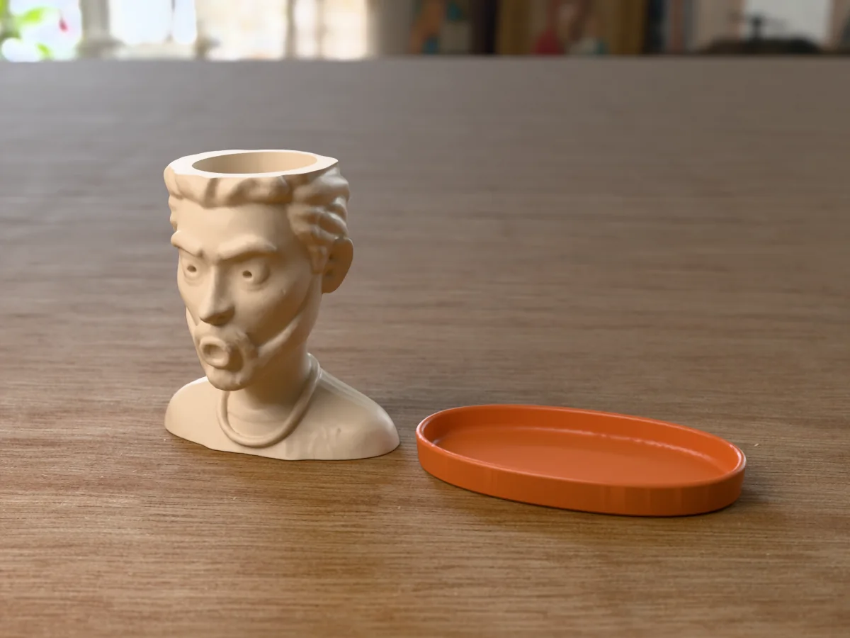 3D render of a 3D-printed shocked face planter with drip saucer, a cartoon head made with the head generator