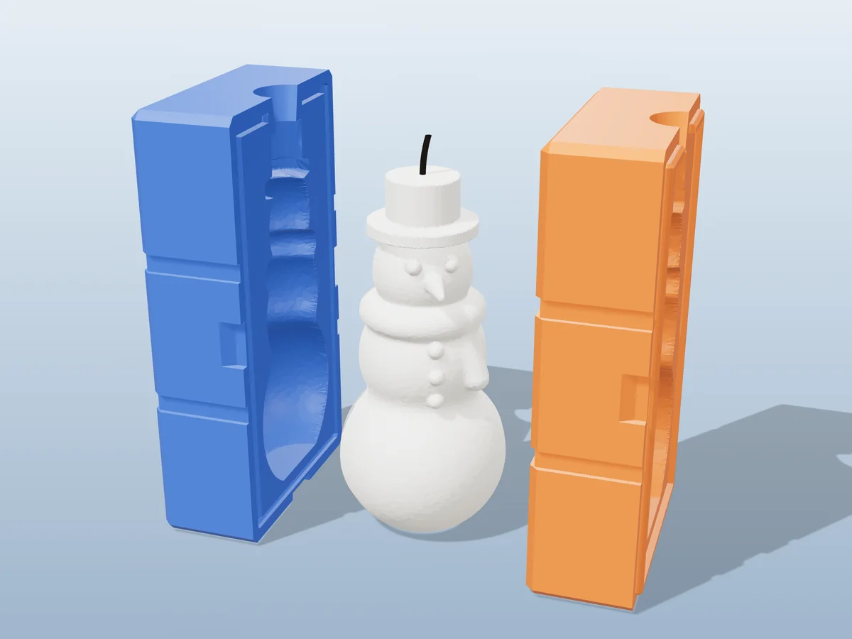 3D render of a white snowman candle with a top hat, scarf and carrot nose between the two printed halves of its rigid blue and orange mold