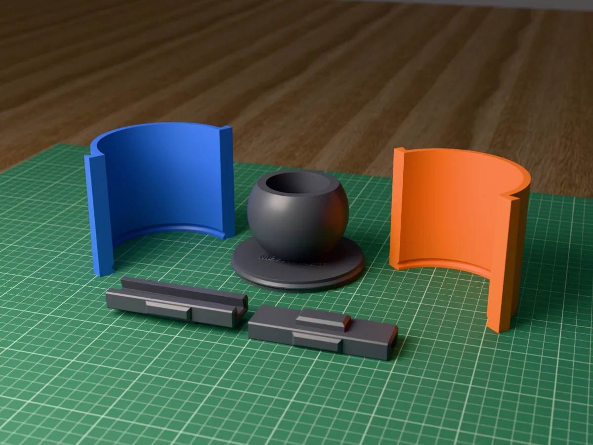 3D render of the sphere planter master fused on its printed charcoal base, between the orange and blue round walls, with the charcoal clamps behind