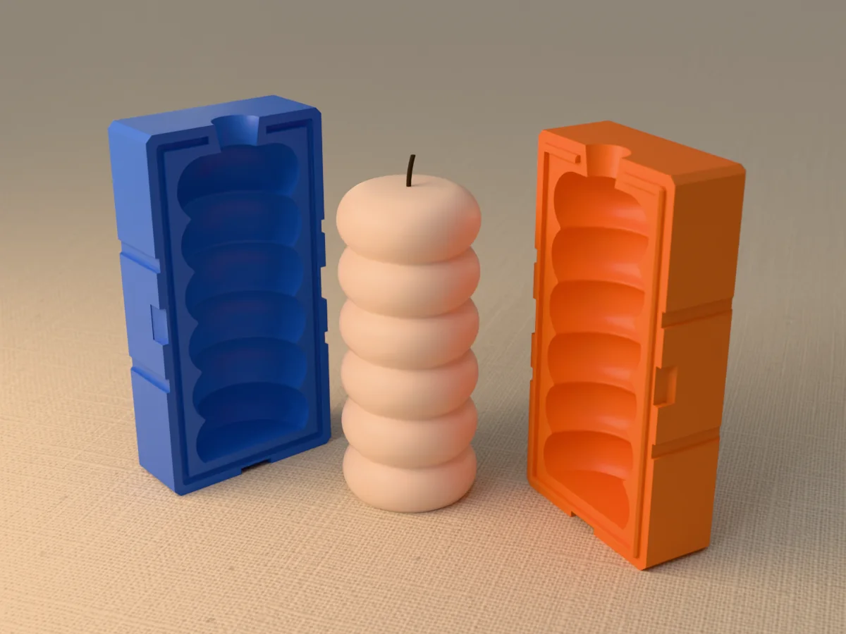 3D render of a stacked donut pillar candle of six rings between the two printed halves of its rigid blue and orange mold