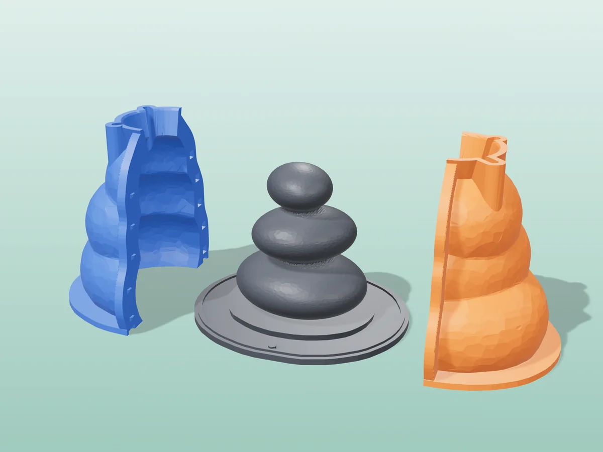 3D render of the three stacked pebbles master fused on its printed charcoal base, between the orange and blue hugging shell halves