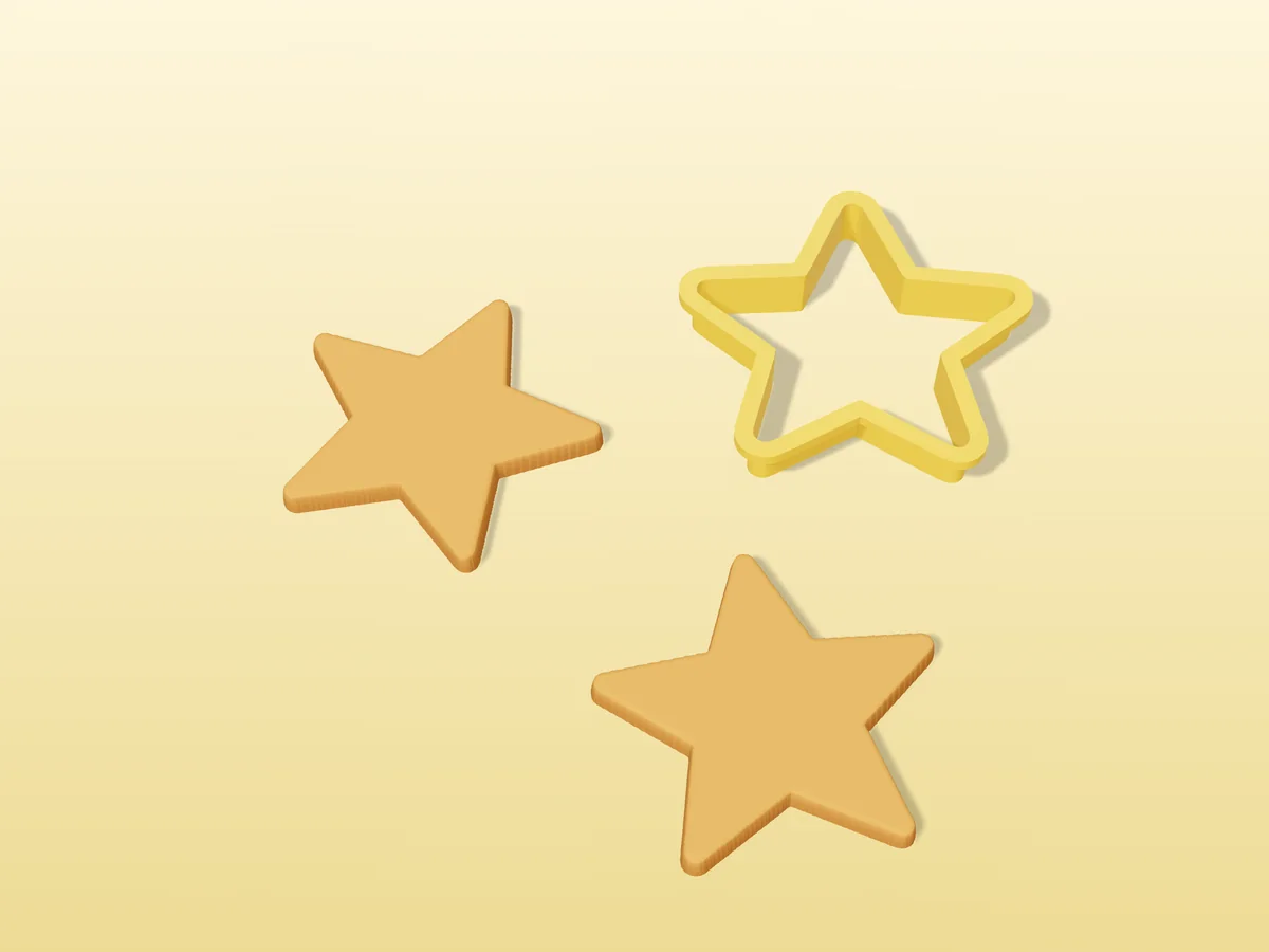 3D render of a yellow 3D-printed star cookie cutter next to two golden baked cookies in the same shape