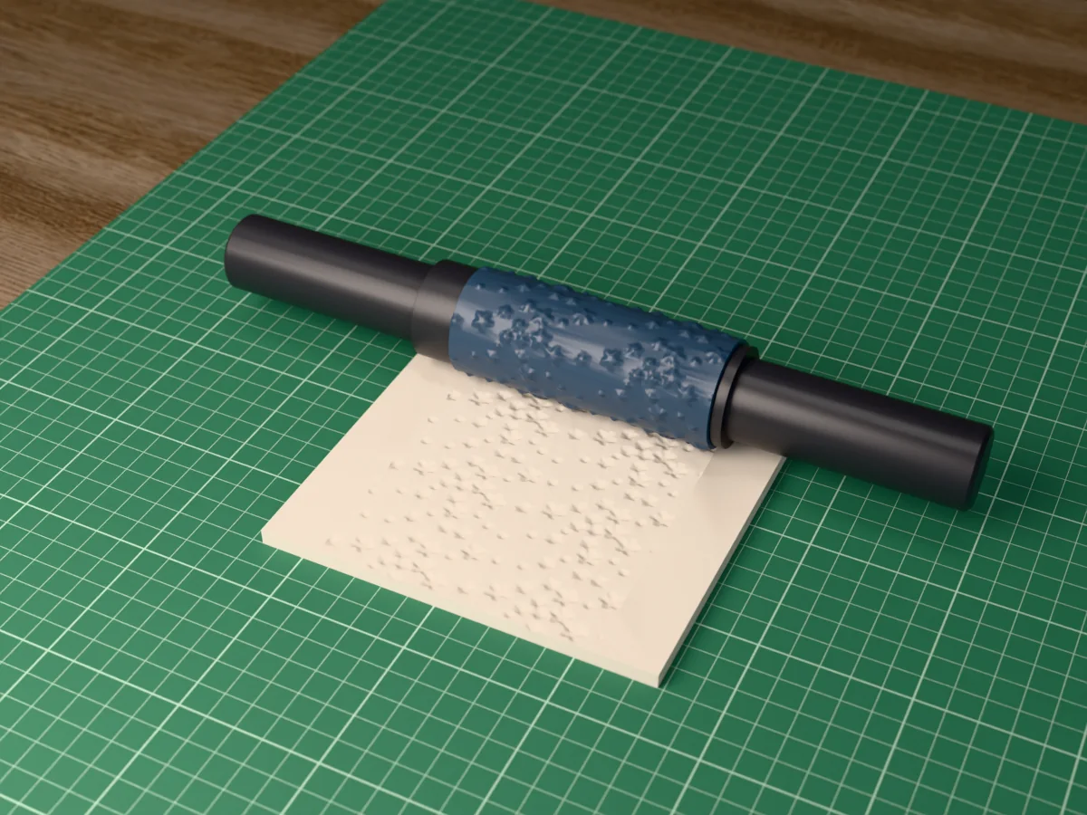 3D render of the printed starry sky textured rolling pin, its patterned sleeve between two dark handles, resting on a slab of clay it has pressed with stars