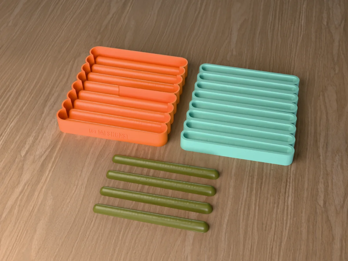 3D render of the printed caster for an eight-cavity silicone stick bait lure mold beside the silicone mold it pours, with green pumpkin soft plastic stick baits in front