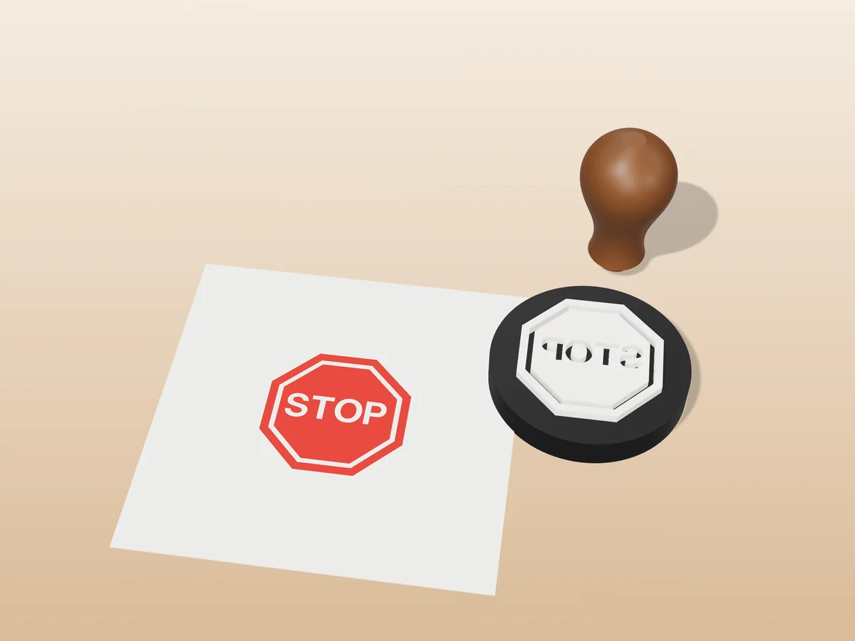 3D render of the printed stop sign stamp, face up next to its brown handle, and its red ink print on a sheet of paper
