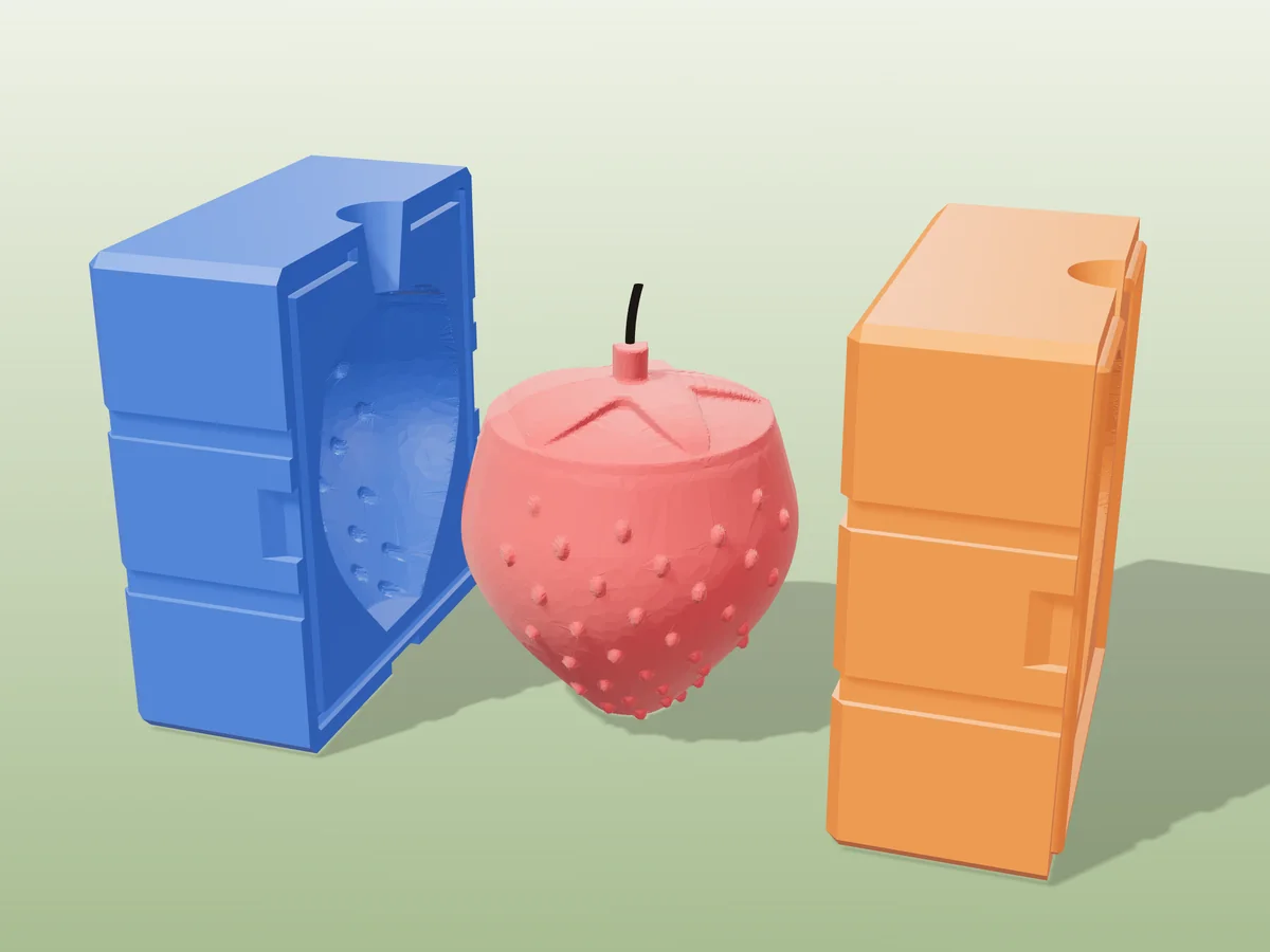 3D render of a red strawberry candle with raised seeds and green leaves between the two printed halves of its rigid blue and orange mold