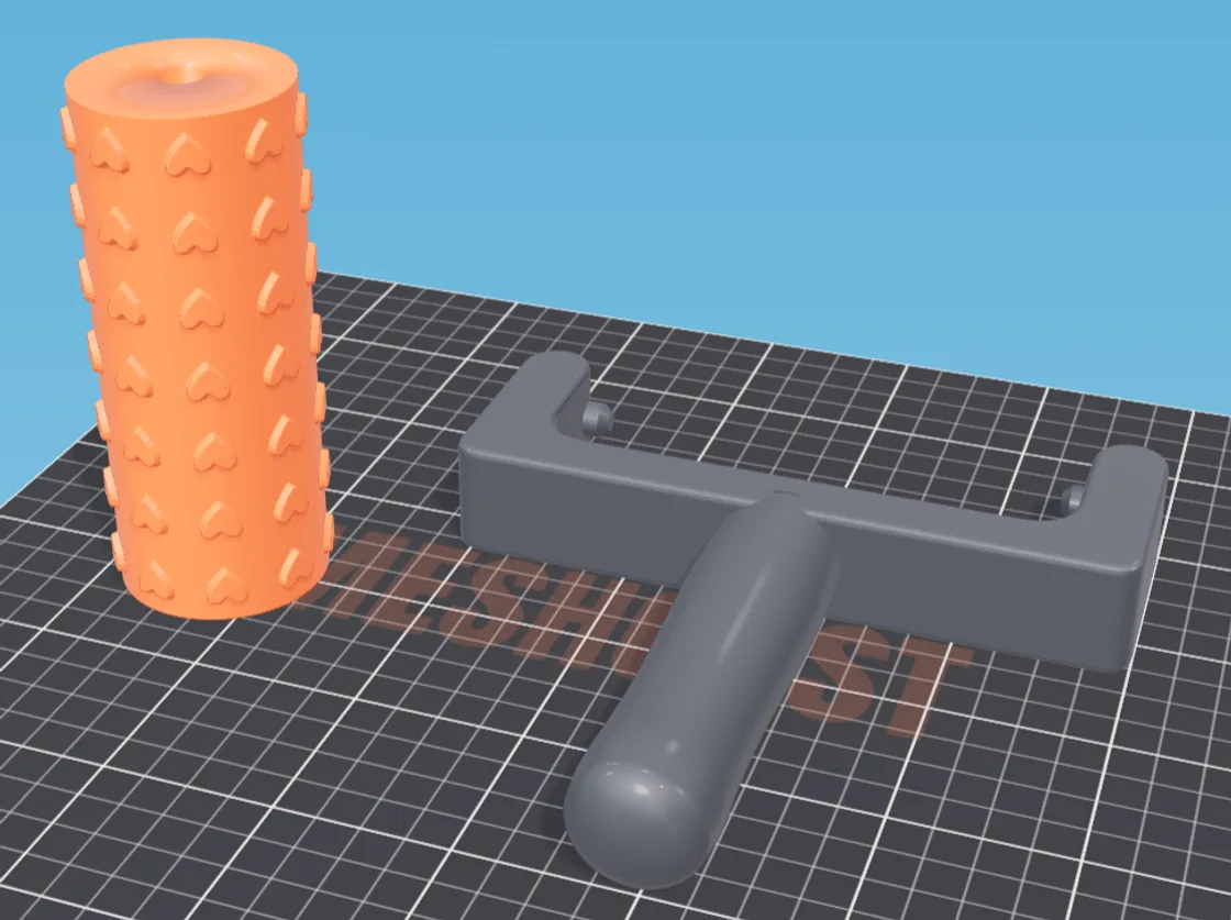 A 3D-printed fork handle with a T grip beside an orange patterned texture roller, on a 3D printer build plate
